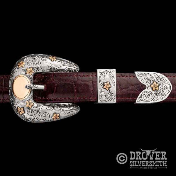 Introducing The Southfork Sterling Silver Buckle Set, a unique hand engraved customizable set with bronze flowers and oval space for up to 4 letters. Add a second loop for a ranger buckle set now!